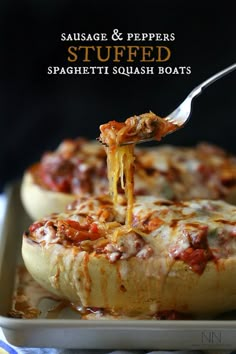 a fork is lifting some food out of an eggplant casserole dish