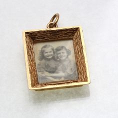 "This is a stunning vintage pendant! This lovely estate pendant is made of 14k yellow gold. It is a solid and substantial picture frame pendant. The borders of the frame have a beautiful textured pattern. There is room on the back to slip a small photo inside. The pendant is in great condition for its age and is stamped \"Rotter 14k.\" The pendant measures approximately 1 3/8\" long (including bail) by 15/16\" wide. It comes in a pouch perfect for safekeeping or gift giving! Please check out my other items, I will combine shipping!" Gold Picture Frame, Gold Picture Frames, Vintage Pendant, Small Photos, Vintage Watches, Antique Jewelry, Picture Frame, Vintage Antiques, Borders