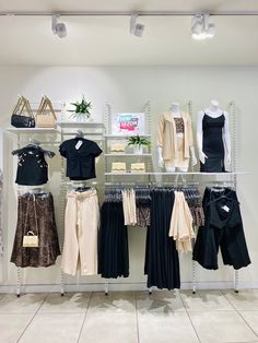 clothes are on display in a clothing store