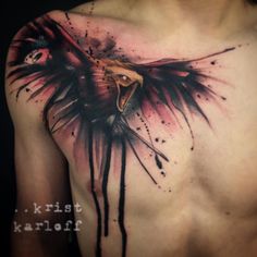 a man's chest with an eagle tattoo on it