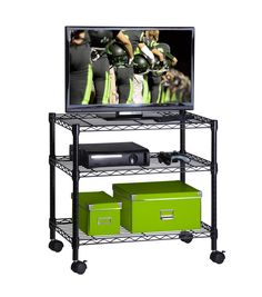 a television is sitting on top of a metal shelf with green drawers and bins