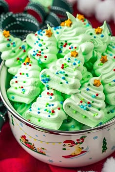 a bowl filled with green frosted christmas trees