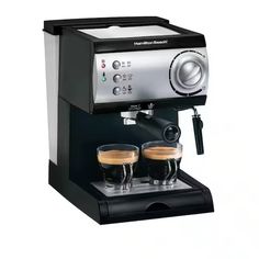 an espresso machine with two cups of coffee