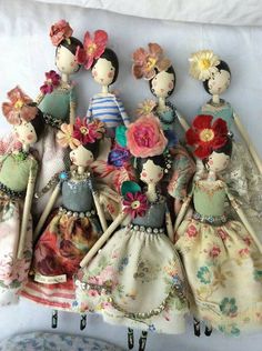 a group of dolls sitting next to each other