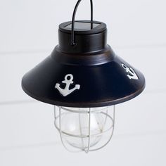 a hanging light with an anchor on it