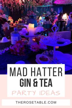 mad hatter gin and tea party with pink flowers on the table in front of it