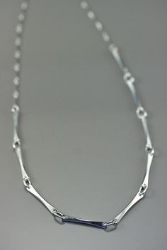 Minimalist chain, link bar chain, modern minimalist, handcrafted sterling silver chain, women chain, artisan jewelry, everyday necklace This modern style chain is made with sterling silver ; its line are subtle and clean, original yet simple at the same time. A unique design, drawn and made by the artist for people who like simple and clean jewelry.  A ideal present  for birthday(anniversary), Mother's Days, wedding, Christmas or to offer itself to oneself! matching earring : https://www.etsy.com/ca/listing/220008855/silver-modern-women-earring-minimalist?ref=shop_home_active_8 matching bracelet : https://www.etsy.com/ca/listing/203645720/delicate-bracelet-silver-women-bracelet?ref=shop_home_active_13 retour à ma boutique : https://www.etsy.com/ca/shop/stephanielemelin?ref=listing-shop2-al Modern Sterling Silver Chain Necklace With Rectangular Links, Modern Sterling Silver Chain Necklace For Everyday, Minimalist Sterling Silver Chain Necklace, Minimalist Sterling Silver Chain Necklace With Rectangular Links, Minimalist Sterling Silver Necklace With Rectangular Links, Silver Chain Women, Minimalist Chain, Creative Necklace, Mens Silver Jewelry