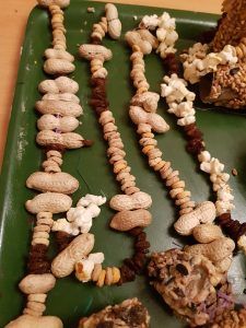 a green tray filled with lots of different types of food