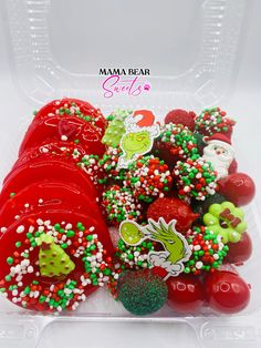 a plastic container filled with red and green candies