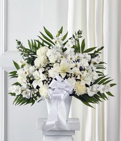 a bouquet of white flowers in a vase