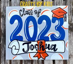 a sign that says class of 2095 joshua on the side of a wooden fence