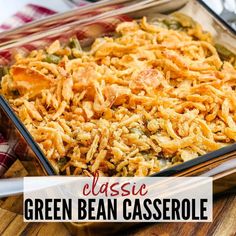 green bean casserole in a glass dish on a wooden cutting board with text overlay reading classic green bean casserole