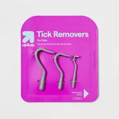 three tick removers in pink package on white background with clipping for texting