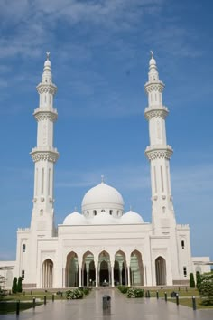 a large white building with two tall towers