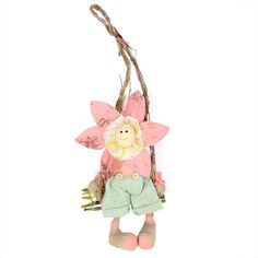 a doll hanging from a tree branch with flowers on it's head and legs