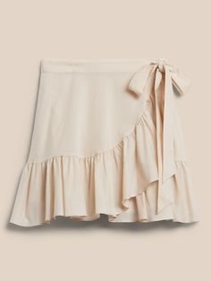 Wrap Ruffle Mini Skirt | Banana Republic Factory Chic Beige Skirt With Ruffle Hem, Chic Skirted Skort With Ruffle Hem, Spring Mini Length Wrap Skirt, Chic Tiered Wrap Skirt For Summer, Chic Short Skirt With Ruffle Hem, Elegant Summer Skirted Skort, Elegant Skirted Skort For Summer, Elegant Mini Wrap Skirt For Summer, Elegant Summer Skort