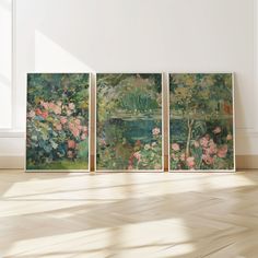 three paintings on the wall in an empty room