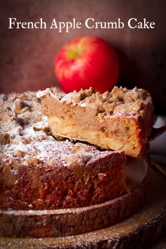 an apple crumb cake on a wooden plate