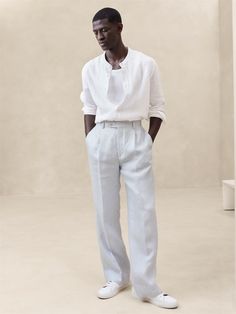 Expertly tailored with modern proportions, this straight-leg pant is cut with a full break at the hem.  For fabric, our designers selected a beautiful, warm-weather ready linen—a fabric we love for its ability to stay cool and crisp, even in heat and humidity.  Tailored Straight Fit: High-rise with a straight leg and full break at the hem.  Zip fly with button closure.  Front and back pockets.  Pleated front.  Unlined.  Tailored Straight fit: High-rise.  Straight through the hip, thigh and leg w Men All White Outfit Party, Blue Linen Pants Outfit Men, White Semi Formal Outfit Men, Full White Outfit Men, Linen Pants Outfit Men, Blue Linen Pants Outfit, Linen Outfit Men, White Outfit Casual, Flowy Linen Pants