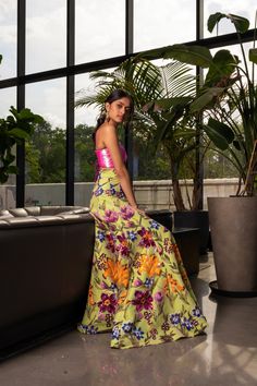 model leaning against a dark leather sofa in a high waisted lime green, floral sequin gabriella lehenga skirt. Styled with a neon iridescent pink sequin bralette top with a lace-up back. Green Sequin Lehenga, Asian Wedding Outfits, Eclectic Western, Colorful Lehenga, Lehenga Outfit, Pink Sequin Top, Sequin Lehenga, Bridal Clothes, Ethnic Wear Indian