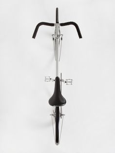 an upside down view of a bike with the handlebars extended and no brake pads