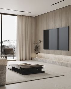 a living room with a large flat screen tv mounted on the wall above a coffee table