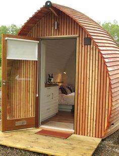 a small wooden cabin with its door open