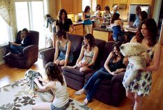 a group of women sitting on couches in a living room