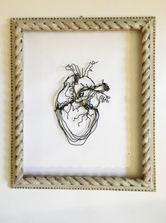 a drawing of a human heart in a frame