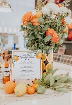 oranges and lemons are arranged on the table for a citrus themed wedding reception