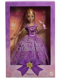 a barbie doll in a purple dress and tiara