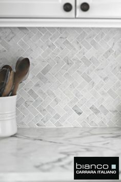 white marble kitchen counter top with utensils