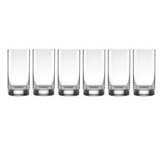 four glasses sitting next to each other on a white surface