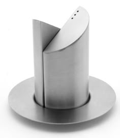 a metal object that is sitting on a plate