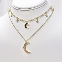 "This listing is for one gold plated moon and star cubic zirconia charm choker necklace with a resizable/adjustable gold plated chain. This necklace is 14\" long with a 3.5\" extension, maximum length of the necklace is 17.5\" long. Perfect piece on its own or great for layering! Complementary moon necklace is available for sale in another listing on my page." Adjustable Celestial Necklace With Star Charm, Adjustable Moon Clavicle Chain Jewelry, Adjustable Moon Shaped Clavicle Chain Jewelry, Adjustable Dangle Jewelry With Star Charm, Adjustable Moon-shaped Clavicle Chain Jewelry, Adjustable Dangle Star Charm Jewelry, Adjustable Celestial Choker Jewelry, Gold Celestial Necklace With Cubic Zirconia, Gold Star Charm Choker