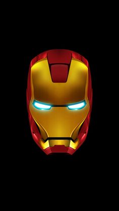 an iron man mask with glowing eyes in the dark