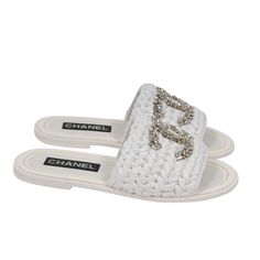 Product Description: White Raffia Exterior With Cc Logo Strass On The Front Size: Eu 41 Condition: New In Box Measurements: ( Approximately In Inches ) Insole: 10.25 Outsole: 10.5 All Items Are 100% Authentic Items Are Limited Brand New In Box W/ Dust Bag Retail Price: $1725 + Tax Our Price: $1525 (Obo) Free Shipping On All Items Make Us An Offer! Elegant White Flat Heel Slippers, Elegant White Flat-heel Slippers, Elegant White Open Toe Slippers, Designer Flat Flip Flops For Beach, Luxury Slip-on Summer Slippers, Luxury Summer Slip-on Slippers, Designer Round Toe Slippers For Summer, Luxury White Flat Heel Sandals, Designer Flat Sandals With Woven Sole