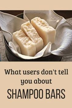 two pieces of soap sitting on top of a white cloth in a metal bowl with the words, what users don't tell you about shampoo bars