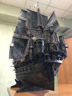 a model of a pirate ship on top of a wooden table