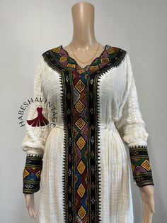 This stunning Habesha Kemis is crafted from 100% cotton Axum Shukor Menen fabric and adorned with 100% handmade Tibeb, reflecting the skill of Ethiopian artisans. Designed as one-size-fits-all, this dress offers comfort and style for any occasion. For custom sizing, send us your measurements, and we'll be delighted to create a personalized fit. Perfect for cultural celebrations, weddings, and more, this timeless piece is a celebration of Ethiopian heritage! Tigray Dress, Ethiopian Dress, Habesha Kemis, Spirit Clothing, Hotel Amenities, Cultural Celebration, Traditional Wear, Traditional Dress, African Clothing