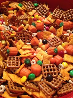 a red bowl filled with halloween snack mix