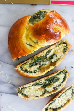 bread with spinach and cheese in it on a marble surface