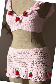 a crocheted pink bikinisuit with strawberries on it