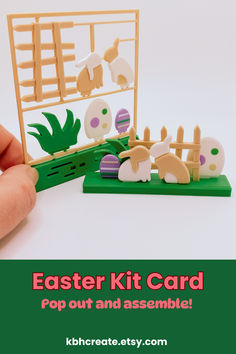 an easter kit card is shown in front of a hand holding it