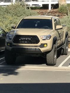 a toyota truck is parked in a parking lot