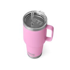 a pink yeti cup with a straw in it on a white background and the lid is open