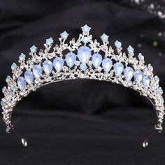 Add a touch of elegance to your special day with our Elegant Gemstone Tone Tiaras. These charming crystal crowns feature romantic hues and sparkling accents, making them perfect for any formal event. The sturdy metal frame ensures long-lasting wear, while the veil loop ends add a touch of sophistication. Stand out and feel like royalty on your big day! material: metal, crystal color: as shown gender: women type: tiara crowns loop ends for veil Opal Tiara, Blue Crystal Crown, Tiaras And Crowns Wedding, Wedding Veil Blusher, Moonlight Wedding Dress, Baroque Crown, Crown Wedding Hair, Crown Hair Accessories, Crystal Crowns