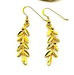 Buy a unique Sterling Silver 925 Gold Plated Olive Leaf Dangle Earrings For Women | Discover a large collection of Ancient Greek Jewelry in our ON-LINE shop | FREE SHIPPING all over the world This product is a beautiful silver 925 dangle earrings inspired by the Ancient Greek Leaf. The Greek Olive Tree Leaf is a strong symbol in Greece. It symbolizes peace, victory, harmony and prosperity. An ideal gift for classic women. ***Type We offer 1 pair of earrings. This pair is gold plated(24K) ***Earrings Size Total Length:4.8cm(1.92 inches) Width:0.9cm(0.36 inches) **Material All my earrings are pure Sterling Silver. This pair is gold plated Gold plating is a method of depositing a thin layer of gold onto the surface of another metal, most often silver (to make silver-gilt), by chemical or elec Greek Accessories, Greek Earrings, Ancient Greek Jewelry, Strong Symbol, Greek Jewelry, Olive Leaf, Classic Women, Olive Tree, Fine Jewellery Earrings