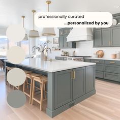 a kitchen with gray cabinets and white counter tops, an island with stools in the middle