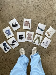 someone's feet in front of several pictures of clothes and shoes on the ground